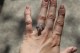 customer photo: 1.5 ct round, F/G Asha, on size 5 finger, in outdoor light.