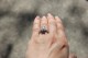 customer photo: 1.5 ct round, F/G Asha, on size 5 finger, in outdoor light.