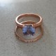 Customer photo: 7mm Light Ceylon blue Avarra sapphire cushion, set in the Aster Double-Prong Cathedral Solitaire, 14kt rose gold, ring size 5.  Band is customer's own.