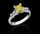 Shown here in platinum with a Flawless Vivid Yellow lab grown center princess1.04ct Takara diamond set in 18kt yellow gold prongs.