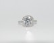Our Timeless Halo in platinum, ring size 6.5 and set with a 7.5mm F/G Asha simulated diamond.