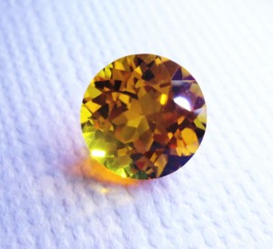 Golden Yellow Avarra sapphire, shown here in an 8mm sapphire cut round.