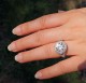Amora Gem 9mm in Timeless Eclipse Halo - outdoors in sun, ring is platinum and size 4.25.