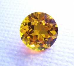 Golden Yellow Avarra sapphire, shown here in an 8mm sapphire cut round.