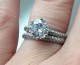 Timeless Regal Micropave Ring set with an 8mm (2ct) Asha Hearts & Arrows round, worn with  matching Eternity Band. Both are palladium and ring size 7.