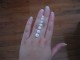 Customer photo showing sizes from 5mm - 9mm (.50, .75, 1.0, 1.25, 1.50, 2.0, 2.75ct).  Her ring finger is approximately a size 6.