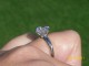 Tiffany Reproduction Ring in palladium.  Ring is a size 4 and is holding an 8mm H color H&A Asha