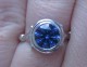 customer photo, 8mm Hearts & Arrows round Kashmir Avarra sapphire, ring is customer's own.